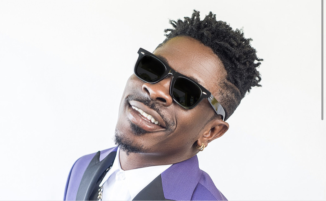 Shatta Wale displays his cars and stacks of cash on his bed